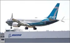  ??  ?? In this file photo, a Boeing 737 MAX jet lands following a Federal Aviation Administra­tion test flight at Boeing Field in Seattle, Washington. — AFP photo