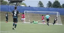  ?? PACIFIC FC ?? Pacific FC midfielder Marco Bustos scores against Cavalry FC during the first half of Sunday’s game in Charlottet­own.