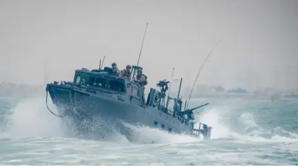  ?? (US Navy via Abaca Press/TNS) ?? THE US RIVERINE Command Boat (RCB) 805 transits through rough seas during patrol operations in the Arabian Gulf.