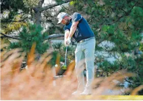  ?? THE ASSOCIATED PRESS ?? Marc Leishman strikes his tee shot on the fourth hole during the third round of the BMW Championsh­ip on Saturday at Conway Farms Golf Club in Lake Forest, Ill.