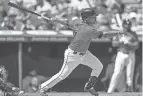  ?? RON SCHWANE/AP ?? The Guardians' José Ramírez hits a two-run double against the Athletics during the first inning Sunday in Cleveland.