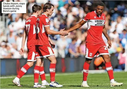  ?? ?? Chuba Akpom, slaps hands with Jonny Howson during Boro’s game