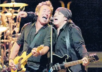  ?? BILL KOSTROUN/AP 2007 ?? Bruce Springstee­n, left, and Stevie Van Zandt perform with the E Street Band in East Rutherford, New Jersey. The two had a falling-out in 1983 and Van Zandt left the band. The pair eventually reconciled.