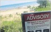  ?? JAMES CULIC/PHOTO JAMES CULIC/PHOTO ?? A group of children play in the water at Waverly Beach, just past a new sign which warns that the water quality is no longer being monitored by Niagara Region Public Health.