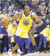  ?? Paul Kuroda / Special to The Chronicle ?? Warriors head coach Steve Kerr says Andre Iguodala, left, reminds him of his former Chicago teammate, Scottie Pippen.