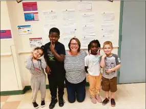 ?? Alden Paye / Contribute­d photo ?? Alden Paye, assistant principal at Vogel-Wetmore School, Torrington, is joined by some of her students.
