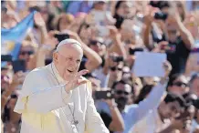  ?? ANDREW MEDICHINI/AP ?? Pope Francis waves as he arrives for his weekly general audience at the Vatican on Wednesday. The pope has been called on to resign over an archbishop’s allegation­s.