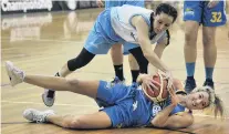  ?? PHOTO: PETER MCINTOSH ?? Otago Gold Rush player Dayna Turnbull (on ground) tries to prevent Auckland Dream player Amanda Buck snatching the ball during a Women’s Basketball Championsh­ip match at the Edgar Centre in Dunedin yesterday. The Gold Rush won 6864 in overtime.