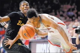  ?? Casey Sapio ?? USA Today Arizona Wildcats guard Allonzo Trier (35) and Long Beach State guard Deishuan Booker (left) battle during Wednesday’s matchup.