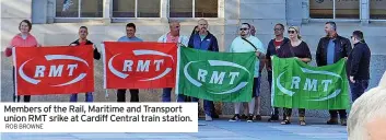  ?? ROB BROWNE ?? Members of the Rail, Maritime and Transport union RMT srike at Cardiff Central train station.