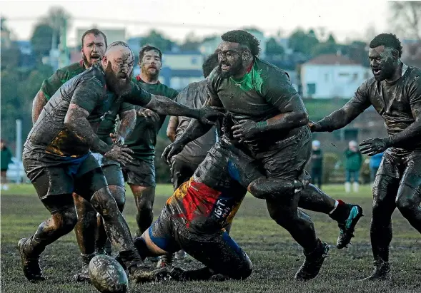  ?? AIMAN AMERUL MUNER/STUFF ?? Celtic and Harlequins players are covered in mud during the South Canterbury senior club rugby semifinals in July.