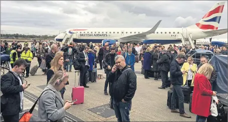  ?? Pictures: PA ?? Hundreds of people were ordered out on the runway at London City Airport after its terminal was evacuated last night