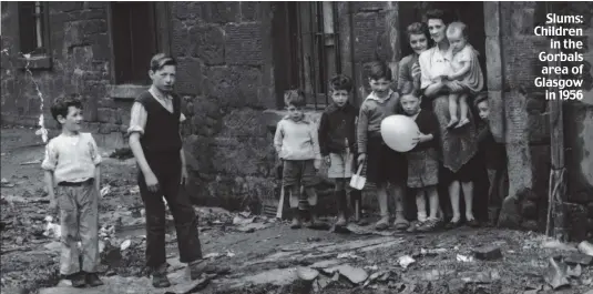  ??  ?? Slums: Children in the Gorbals area of Glasgow in 1956