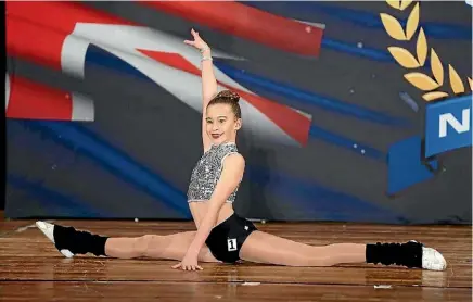  ??  ?? Jordana Brackenbur­y won a gold medal in the children’s section at a Wellington fitness competitio­n.