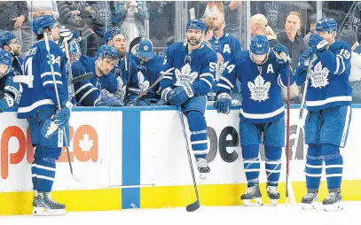  ?? USA TODAY SPORTS ?? Toronto Maple Leafs centre Auston Matthews (34), defencemen Mark Giordano (55) and Morgan Rielly (44) and centre Jason Spezza (19) wait at the bench after losing against the Tampa Bay Lightning at the end of the third period of Game 7 of the first round of the 2022 Stanley Cup playoffs at Scotiabank Arena.