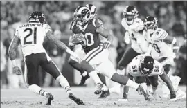  ?? Wally Skalij Los Angeles Times ?? THE RAMS’ Todd Gurley (30) finds running room in the middle of the field as the Bears’ Ha Ha Clinton-Dix (21) closes in during the first quarter Sunday night.