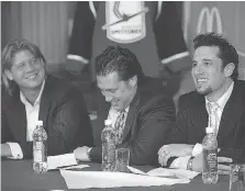  ?? DAN JANISSE ?? Peter Dobrich, left, Warren Rychel and Bob Boughner address the media in 2006 after becoming the owners of the Windsor Spitfires.