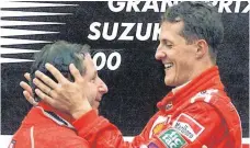  ?? FOTO: DPA ?? Lange her: Ferrari-Teamchef Jean Todt (li.) und sein Fahrer Michael Schumacher feiern im Oktober 2000 einen Grand-Prix-Sieg in Suzuka.