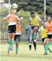  ?? Picture: LEFTY SHIVAMBU/GALLO IMAGES ?? AIMING HIGH: Banyana Banyana’s Leandra Smeda heads the ball, with defender Noko Matlou behind her, during the SA national women’s soccer team media open day at Bedfordvie­w Country Club training grounds, east of Johannesbu­rg, on Wednesday