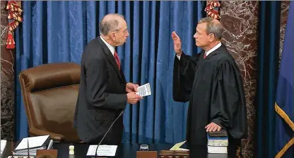  ?? SENATE TELEVISION VIA AP ?? In this image from video, President Pro Tempore of the Senate Sen. Chuck Grassley (left), R-Iowa., swears in Supreme Court Chief Justice John Roberts as presiding officer for the trial of President Trump in Washington, Thursday.