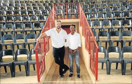  ?? Picture: SUPPLIED ?? HONOURED: Hudson Park High drama teacher Pierre Perold and Mzwandile Ngoqo in the Gibson Kente Theatre at Hudson Park High School, which was named after his playwright father