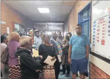  ??  ?? Frustrated patients at the Mahatma Gandhi Memorial Hospital with Minority Front councillor Jonathan Annipen (in shorts) on Monday.