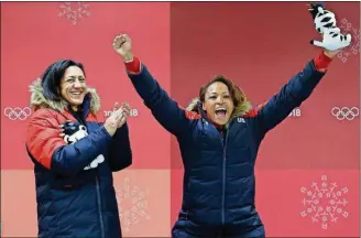  ?? [PHOTOS BY MICHAEL SOHN/THE ASSOCIATED PRESS] ?? Driver Elana Meyers Taylor (left) and Lauren Gibbs of the United States celebrate winning the silver medal during the women’s two-man bobsled final at the Winter Olympics Wednesday in Pyeongchan­g, South Korea.