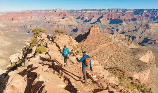  ?? JOHN BURCHAM/THE NEW YORK TIMES PHOTOS 2020 ?? Hikers head down the South Kaibab Trail in Grand Canyon, Arizona. The point of Phantom Ranch is the experience involved in getting there.