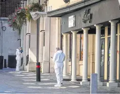  ?? Credit: Jim Bennett ?? Above and below, police and forensics officers outside the Gallery Nightclub last August