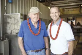  ??  ?? Ulupalakua Ranch’s Pardee Erdman, one of the former owner investors of Maui Gold Pineapple Co., stands with Joe LeVecke, president of Maui Gold Pineapple Co. and Hali‘imaile Distilling Co.