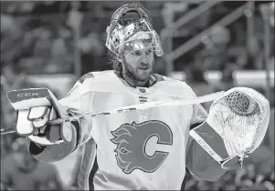  ?? CP PHOTO ?? In this Jan. 14, 2018, file photo, Calgary Flames goaltender Mike Smith returns to the net during an NHL game against the Carolina Hurricanes in Raleigh, N.C.