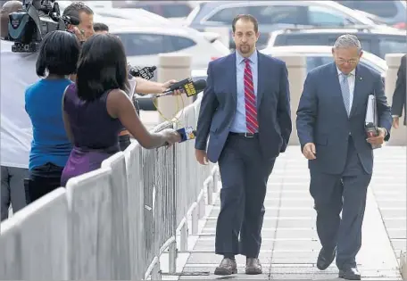  ?? Ed Murray Associated Press ?? SEN. ROBERT MENENDEZ (D-N.J.), right, last month. He is accused of accepting gifts for years from a wealthy Florida eye doctor.