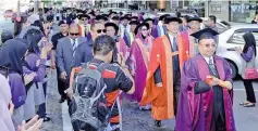  ??  ?? UMS Vice Chancellor Datuk Dr Harun Abdullah leading the Town and Gown parade in the city yesterday.