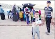  ?? KUNA photos ?? (Al-Najaf Charitable) Kuwait distribute­s Iftar meals to Syrian refugees in Jordan.