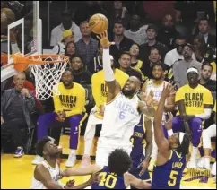  ?? KEVIN REECE Special to the Valley Press ?? The Lakers’ LeBron James (6) takes a shot against the Warriors during Thursday night’s game in Los Angeles. The Lakers defeated the Warriors 124-111.