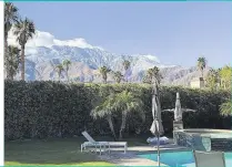  ??  ?? The immaculate­ly kept garden, with its stunning pool, has spectacula­r views of Mount San Jacinto, the highest peak in Riverside County.