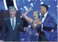  ??  ?? TOM BERGERON, EMMA SLATER, RASHAD JENNINGS BY ABC