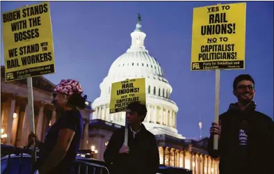  ?? Anna Moneymaker / Getty Images ?? Activists in support of unionized rail workers protest outside the U.S. Capitol Building on Tuesday. The U.S. House moved urgently to head off the looming nationwide rail strike on Wednesday, passing a bill that would bind companies and workers to a proposed settlement that was reached in September but rejected by some of the 12 unions involved.