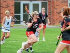  ?? SAM STEWART - DIGITAL FIRST MEDIA ?? Boyertown’s Hailey Heimbach drives in before letting a shot go for her 100th career goal during the first half of the Bears’ 15-8 victory over Pope John Paul II.