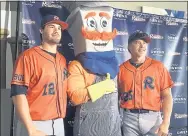  ?? STEPHEN HAWKINS — THE ASSOCIATED PRESS ?? The Cleburne Railroader­s’ Patrick Palmeiro, left, and his father, former Major League player Rafael Palmeiro, right, pose for a photo with teammascot Spike after a news conference Thursday.