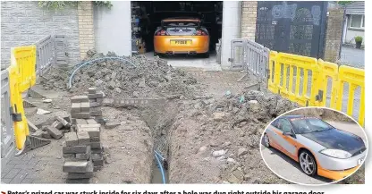  ??  ?? > Peter’s prized car was stuck inside for six days after a hole was dug right outside his garage door