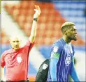  ??  ?? EARLY BATH: Wigan’s Cédric Kipré is sent packing by the referee