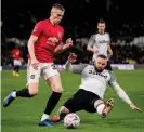  ?? Photograph: Ashley Donelon/Manchester United via Getty Images ?? Wayne Rooney flies into a tackle with Scott McTominay.