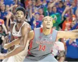  ?? ALEX MENENDEZ/GETTY IMAGES ?? Brandon Miller of the Gardner-Webb battles for position with Florida’s Kevarrius Hayes, left, during Monday night’s game.