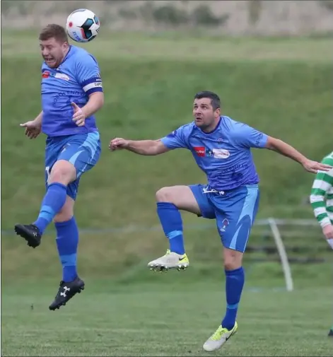  ??  ?? North End United’s Paul Murphy gets his head to the ball as his brother, Jason, looks on during their recent win over Sheriff Y.C.