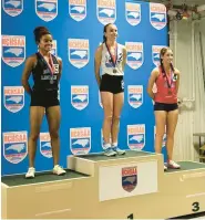  ?? BILLY FOLKES ?? Kayla Folkes, center, a First Flight High School freshman, won gold in the North Carolina High School Athletic Associatio­n 2024 Indoor Track and Field State Championsh­ips last Saturday in WinstonSal­em.