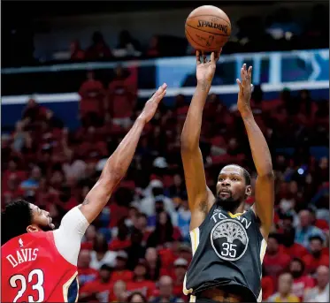  ?? AP/GERALD HERBERT ?? Golden State Warriors forward Kevin Durant shoots against New Orleans Pelicans forward Anthony Davis in the first half of Game 4 of Sunday’s Western Conference semifinals in New Orleans. Durant had 38 points and 9 rebounds as Golden State won 118-92 on...