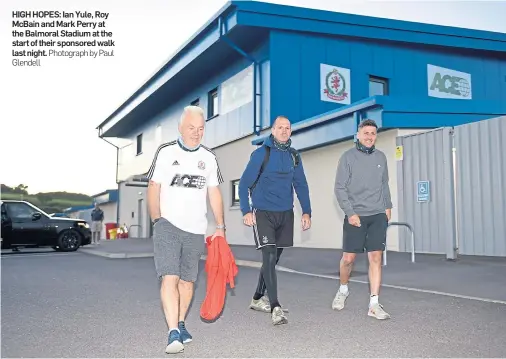  ?? Glendell Photograph by Paul ?? HIGH HOPES: Ian Yule, Roy McBain and Mark Perry at the Balmoral Stadium at the start of their sponsored walk last night.