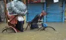  ?? REX/Shuttersto­ck ?? A rickshaw rider navigates a flooded street in Sylhet, Bangladesh. Photograph: Md Rafayat Haque Khan/Zuma Press Wire/