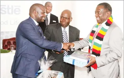  ??  ?? President Mnangagwa receives a token of appreciati­on from Nestle Zimbabwe chairman Mr Kumbirayi Katsande (centre) and Nestle managing director Ben Ndiaye (left), while Vice President General Constantin­o Chiwenga (Retired) looks on during the official...